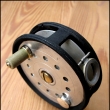 Rousek mu�ka�sk� navij�k se zadn� brzdou, �ehta�kou, achatinov� vod�c� o�ko,pr�m�r 85 mm, zna�en Rousek na matici brzdy.